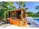 A luxurious outdoor gazebo houses a jetted hot tub, perfect for relaxation and privacy at 11209 Spring St, Largo, FL 33774