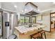 Bright kitchen featuring stainless steel appliances and center island cooktop with bar seating at 11209 Spring St, Largo, FL 33774