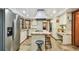 Spacious kitchen with stainless steel appliances and center island with seating at 11209 Spring St, Largo, FL 33774