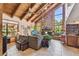 Spacious living room features vaulted wood ceilings, stone fireplace, and large windows at 11209 Spring St, Largo, FL 33774