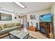 Cozy living room with comfortable seating, an electric fireplace, and natural lighting at 11209 Spring St, Largo, FL 33774