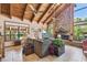 Bright living room with vaulted ceilings, stone fireplace, and neutral decor at 11209 Spring St, Largo, FL 33774