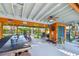 Inviting outdoor bar with a view of the backyard featuring a sitting area and storage at 11209 Spring St, Largo, FL 33774