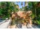 A tranquil rock waterfall feature adds natural beauty and soothing sounds to the outdoor space at 11209 Spring St, Largo, FL 33774