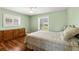 Bedroom with hardwood floors and natural light from the windows at 1140 Mcfarland St, Dunedin, FL 34698