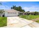 Charming single-story home with a two-car garage and well-kept lawn at 1140 Mcfarland St, Dunedin, FL 34698