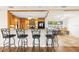 Kitchen area with bar seating, wooden cabinets, and black appliances at 1140 Mcfarland St, Dunedin, FL 34698