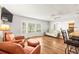 Spacious living room offers hardwood floors, a bay window, and an open layout at 1140 Mcfarland St, Dunedin, FL 34698