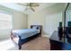 Comfortable bedroom featuring a bed, a closet, and dresser at 11252 Merganser Way, New Port Richey, FL 34654