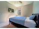 Comfortable bedroom with bed and TV mounted on the wall at 11252 Merganser Way, New Port Richey, FL 34654