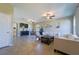 Open living room with tile floors, ceiling fans, and neutral wall color at 11252 Merganser Way, New Port Richey, FL 34654