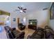 Cozy living room features leather seating and tile floors at 11438 Merganser Way, New Port Richey, FL 34654