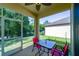 Relaxing screened patio with outdoor seating, ideal for enjoying the serene backyard views at 11252 Merganser Way, New Port Richey, FL 34654