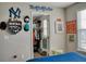 Inviting bedroom, decorated with sports memorabilia, featuring a walk-in closet for ample storage at 12327 Eagle Swoop Pl, Riverview, FL 33579