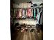 Spacious walk-in closet with plenty of hanging space, shelving, and shoe racks for optimal organization and storage at 12327 Eagle Swoop Pl, Riverview, FL 33579