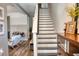 Stylish entryway with stairs, wood floors, and a view of the living room, perfect for welcoming guests at 12327 Eagle Swoop Pl, Riverview, FL 33579