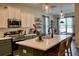 Modern kitchen with white cabinets, stainless steel appliances, and a large center island at 12327 Eagle Swoop Pl, Riverview, FL 33579