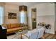 Open concept living area with a stylish leather sofa, accent chairs, and bar cart at 12327 Eagle Swoop Pl, Riverview, FL 33579