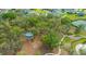Community park featuring a covered gazebo, playground equipment, mature trees, and walking paths for outdoor enjoyment at 12327 Eagle Swoop Pl, Riverview, FL 33579
