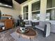 Comfortable screened patio includes cozy seating and an outdoor table at 12327 Eagle Swoop Pl, Riverview, FL 33579
