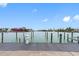 Water view backyard with a dock at 12360 Capri N Cir # 106, Treasure Island, FL 33706