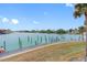 Water view backyard with a nice dock, gorgeous water, and palm trees at 12360 Capri N Cir # 106, Treasure Island, FL 33706