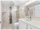This bathroom features a walk-in shower and a stylish vanity at 12360 Capri N Cir # 106, Treasure Island, FL 33706