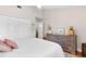 Well-lit bedroom featuring hardwood floors, closet and neutral walls at 12360 Capri N Cir # 106, Treasure Island, FL 33706