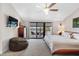 Comfortable bedroom with a private balcony, neutral carpet, and a ceiling fan creating a relaxing retreat at 12360 Capri N Cir # 106, Treasure Island, FL 33706