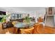 Open floor plan with dining area, living room and access to balcony at 12360 Capri N Cir # 106, Treasure Island, FL 33706