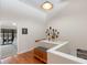 Bright hallway with a built-in bench, white trim and decor leading to the bedroom and featuring hardwood floors at 12360 Capri N Cir # 106, Treasure Island, FL 33706
