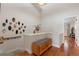 This hallway features hardwood floors and unique wall decorations at 12360 Capri N Cir # 106, Treasure Island, FL 33706
