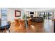 Open-concept living and dining area with hardwood floors and a waterfront view at 12360 Capri N Cir # 106, Treasure Island, FL 33706