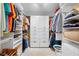 Spacious walk-in closet with custom shelving and plenty of storage space at 12360 Capri N Cir # 106, Treasure Island, FL 33706