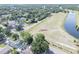 An aerial view of a neighborhood showcasing the proximity to a beautiful lake at 12595 95Th N St, Largo, FL 33773