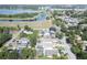 Overhead view of home featuring backyard patio and lush landscaping near a beautiful body of water at 12595 95Th N St, Largo, FL 33773