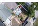 A backyard featuring a pool, outdoor seating, and lush landscaping at 12595 95Th N St, Largo, FL 33773