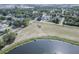 An aerial view of a neighborhood showcasing the proximity to a beautiful lake at 12595 95Th N St, Largo, FL 33773