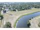 An aerial view of a neighborhood showcasing the proximity to a beautiful lake at 12595 95Th N St, Largo, FL 33773