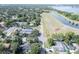 An aerial view of a neighborhood showcasing the proximity to a beautiful lake at 12595 95Th N St, Largo, FL 33773