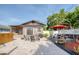 Charming backyard with a stone patio, hot tub, outdoor seating, and a stylish picnic area at 12595 95Th N St, Largo, FL 33773