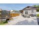 Backyard featuring a stone patio, hot tub, and various outdoor furniture, ideal for relaxing or entertaining at 12595 95Th N St, Largo, FL 33773