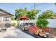 Backyard featuring patio, dining and lounge furniture, lush landscaping, and a picnic area at 12595 95Th N St, Largo, FL 33773