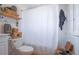 Bathroom featuring built-in shelving and decorative baskets at 12595 95Th N St, Largo, FL 33773