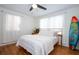 Bright bedroom includes a surfboard for decor at 12595 95Th N St, Largo, FL 33773