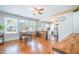 Cozy dining area with natural light, hardwood floors, an eating table, and seamless flow into the kitchen at 12595 95Th N St, Largo, FL 33773