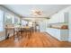 Eat-in kitchen boasts hardwood floors, large windows, a built-in table, and ample counter space at 12595 95Th N St, Largo, FL 33773