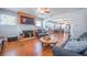 Inviting living room with a brick fireplace, hardwood floors, and an open layout that leads to the kitchen at 12595 95Th N St, Largo, FL 33773