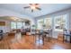 Open floor plan living room connects to a dining area and features hardwood floors and natural light at 12595 95Th N St, Largo, FL 33773