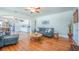 Bright living room featuring hardwood floors, an archway, recessed lighting, and stylish furnishings at 12595 95Th N St, Largo, FL 33773